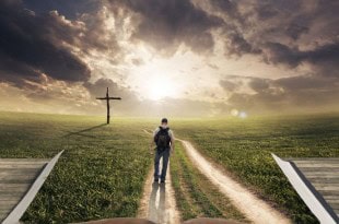 Man walking on a Bible towards a cross